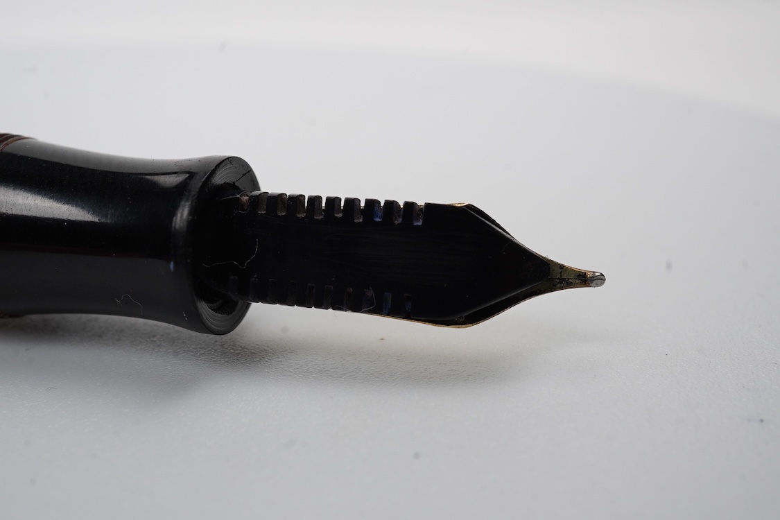 A Parker Senior UK Duofold 'red candy stripe' fountain pen with 14ct. gold 'N' nib